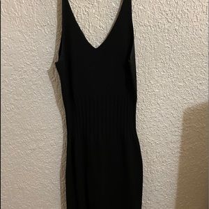 Black pencil dress with slit at the leg. Worn Once